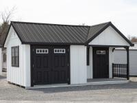 Custom 12x20 Victorian Building with Porch and with White LP Board N Batten Siding, Black Doors, Black Trim, and Black Metal Roof