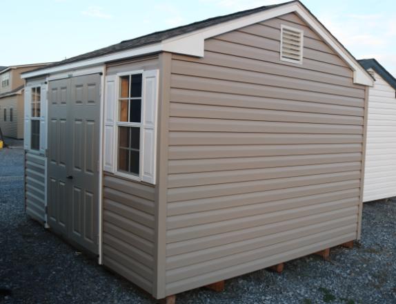 Pine Creek 10x12 HD Peak with Pebble Clay walls, White trim and White Raised Panel shutters, and Weatherwood shingles