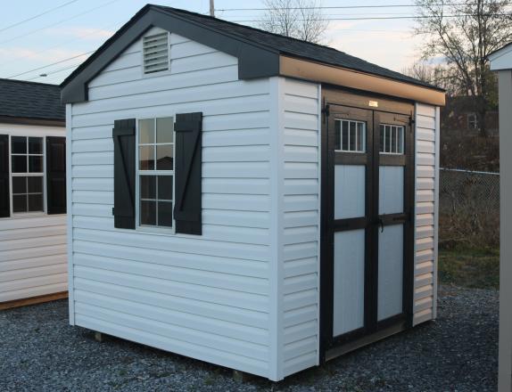 Pine Creek 8x8 HD Peak with White walls, Black trim and Black Z-Style shutters, and Charcoal shingles