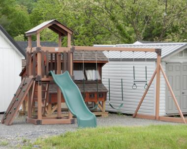 Busy Base Camp Play Set in Woodgrain Brown Vinyl with Green Slides and Swings