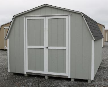 Pine Creek 10x12 HD Mini Barn with Light Gray walls, White trim and White shutters, and Charcoal shingles