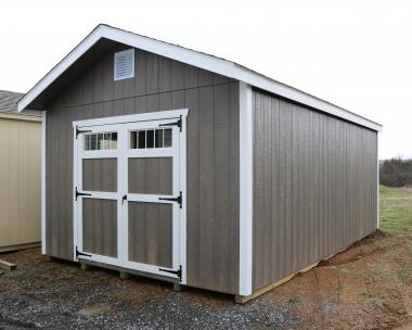 Pine Creek 12x20 HD New England Peak with Driftwood walls, White trim and White shutters, and Charcoal shingles