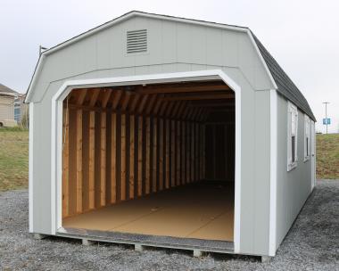 Pine Creek 12x28 Dutch Garage with Light Gray walls, White trim and White shutters, and Charcoal shingles